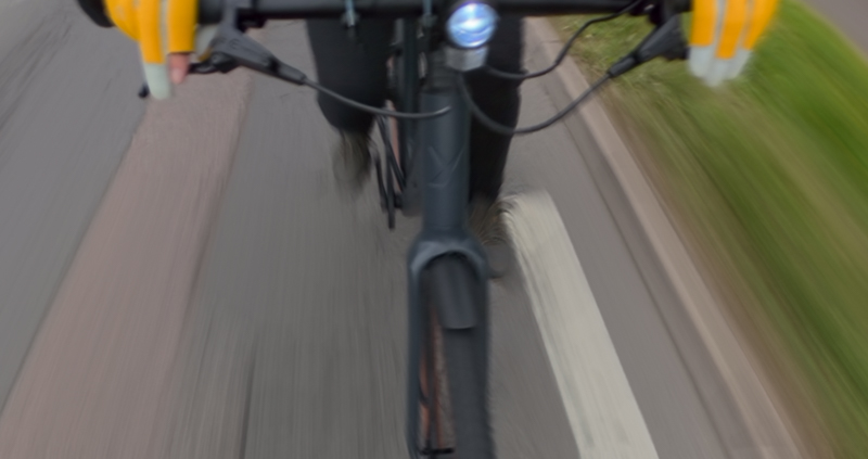 Front wheel with blurred road below